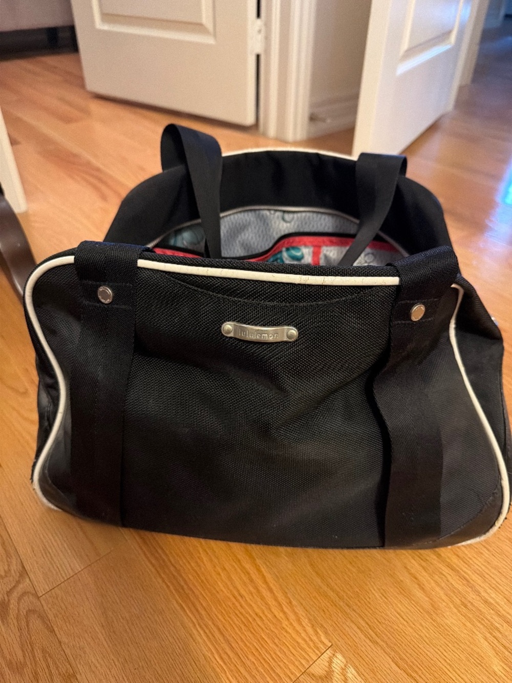 Lululemon Black Duffel Bag - floral pattern interior